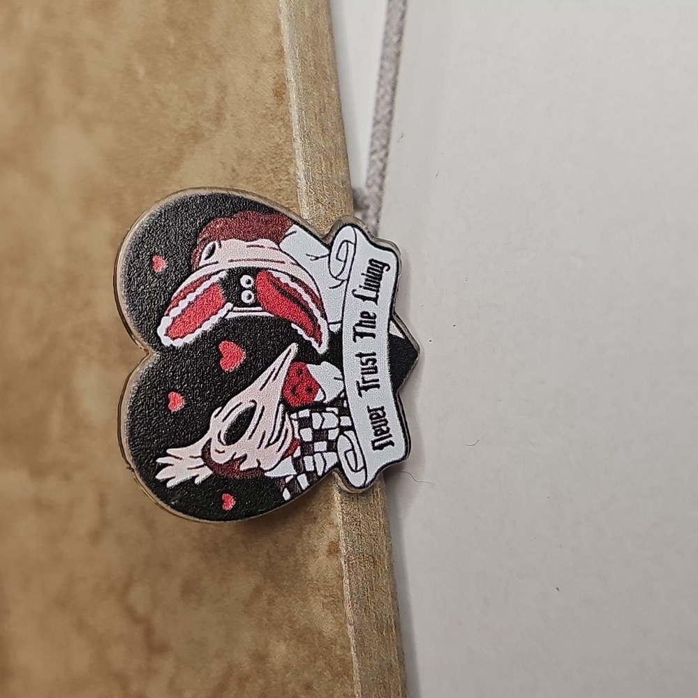 Heart-Shaped Bettlejuice Pin with Quirky Design